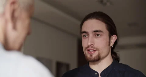 Son talking with father during visit Stock Footage 196236047