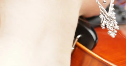 Sonata performance by bare-shouldered violinist, skill evident Stock Footage 269880447