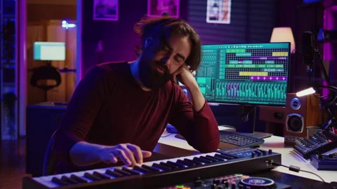 Songwriter getting upset after hearing wrong piano notes Video stock 268506744