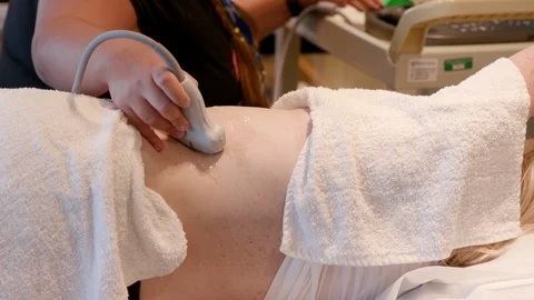 Sonographer Scans Woman's Back Stock Footage 114180960