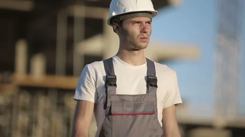 Сonstruction engineer walks at camera inspects the site Stock Footage 53465803