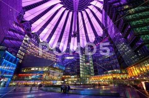 Sony Center in Berlin at night with purple lights on the ceiling Stock Photos