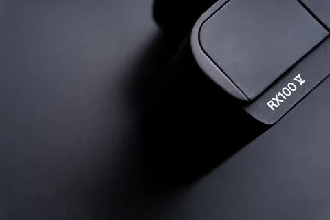 Sony compact or mirrorless camera closeup on black background Stock Photos