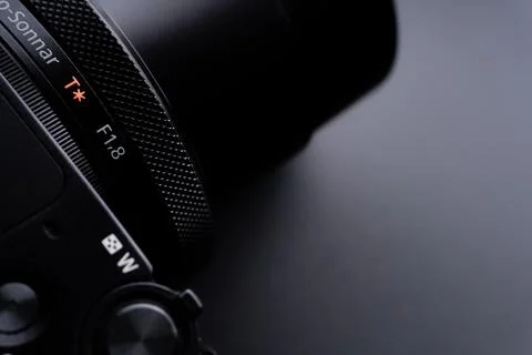 Sony compact or mirrorless camera closeup on black background Fotos de archivo