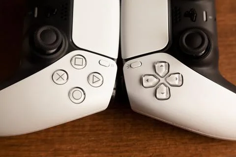 Sony PS5 Wireless Controller,on an oak wooden table,PlayStation is video gaming Stock Photos