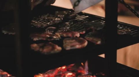 Сook prepares steaks on the grill Vídeo Stock 61075724