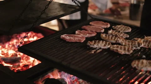 Сook prepares steaks on the grill Video stock 61076338