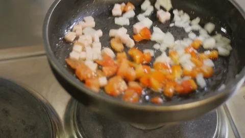 The Сook Shakes the Pan with the Vegetables Stock Footage 98149022