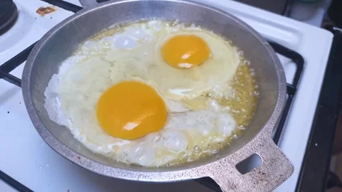 Сooking Fried Eggs For Breakfast, Stock Footage 254003310