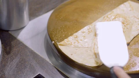 Сooking huge pancakes. Hand of cook closeup Video stock 123142053