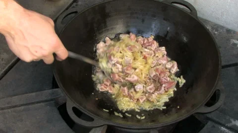 Сooking pilaf in Wok Stock Footage 960397