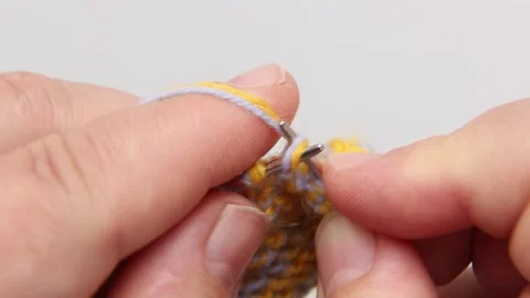 Soothing ASMR knitting tutorial with colorful yarn threading technique 스톡 동영상 311894554