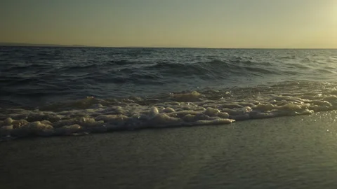 Soothing waves floating on the beach Video stock 212949209