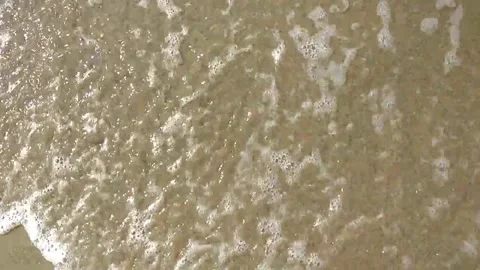 Soothing waves passing by sandy beach, top view Stock-Footage 154215484