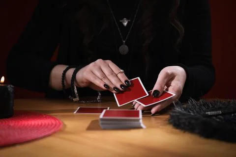 Soothsayer predicting future with cards at table indoors, closeup Stock-Fotos