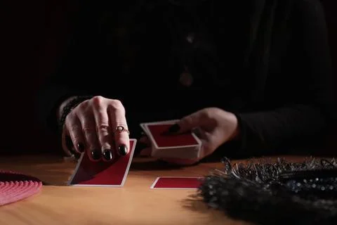 Soothsayer predicting future with cards at table indoors, closeup 写真素材