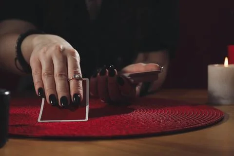 Soothsayer predicting future with cards at table indoors, closeup Stock Photos