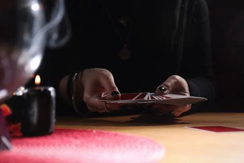 Soothsayer predicting future with cards at table indoors, closeup 스톡 사진