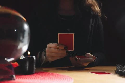 Soothsayer predicting future with cards at table indoors, closeup 写真素材