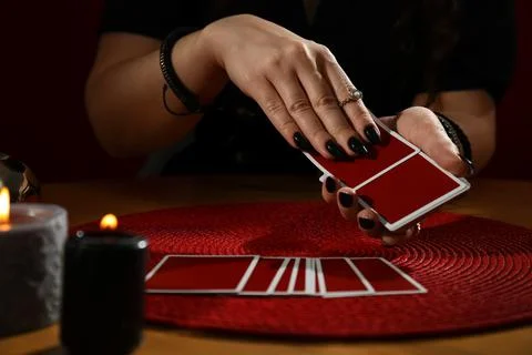 Soothsayer predicting future with cards at table indoors, closeup Stock-Fotos