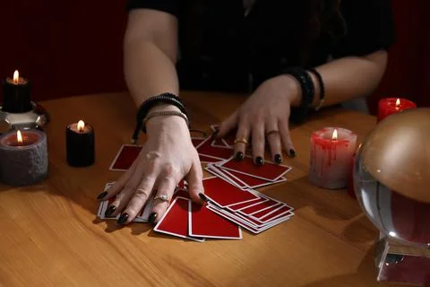 Soothsayer predicting future with cards at table indoors, closeup Stock-Fotos