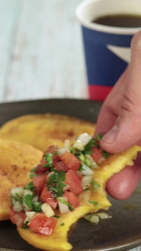 Sopaipillas with bite, grabbing with the hand, of pumpkin or squash and peb.. Stock Footage 244964646