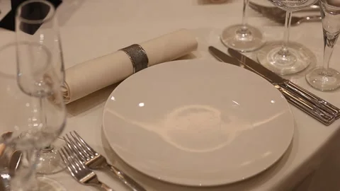 Sophisticated arrangement featuring classic tableware and ambiance Vídeos de archivo 327013880