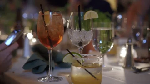 Sophisticated Drinks And Intimate Setting, Refined Table Arrangement With Stock Footage 323772786