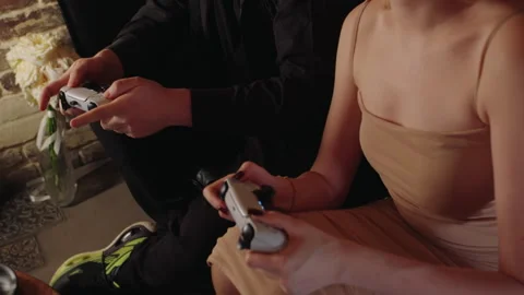 Sophisticated lovers engrossed in electronic controls at cozy cafe Video stock 331885705