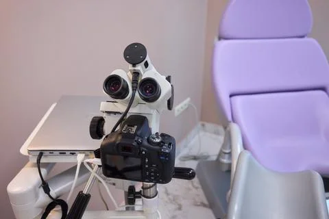A sophisticated microscope equipped with a camera, providing enhanced Stock Photos