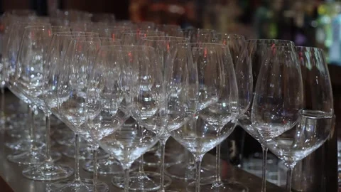 Sophisticated Serving Area Featuring Pristinely Arranged Empty Wine Glasses And Stock Footage 323777119