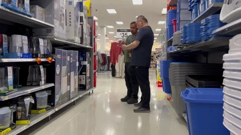 Sopper is asking the staff to buy a fridge in the Walmart store Stock Footage 254325022