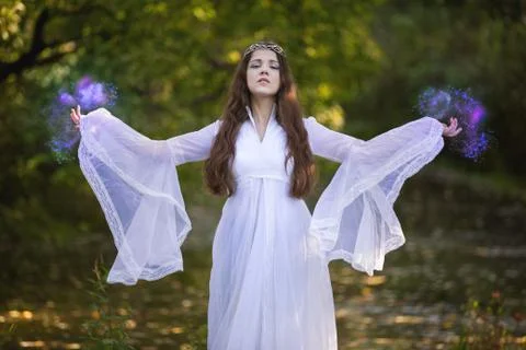 Sorcerer practicing magic in the forest Stock Photos