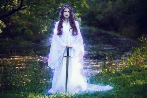 The sorcerer with the sword in the forest Stock Photos