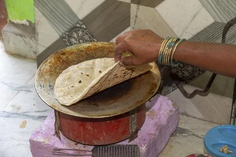 Sorghum flatbread cooking is underway in the kitchen. This is bread. It's m.. Stock Photos