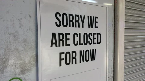 "Sorry we are closed for now" retail shop sign. London UK. Stock Footage 143928275