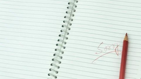 Sorry written on open notebook. Closeup. Mistake learning, blooper, regret sa Stockfoto's