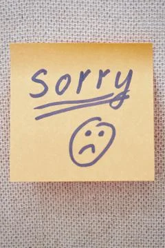 Sorry written on a sticky note Stock Photos