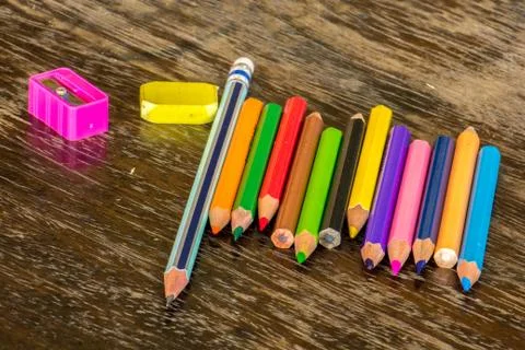Sort crayons flooring surfaces, bright colors, red, yellow, black, orange and Stock Photos