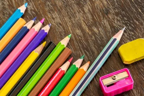 Sort crayons flooring surfaces, bright colors, red, yellow, black, orange and Stock Photos