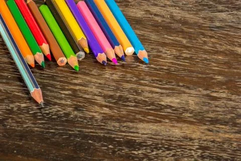 Sort crayons flooring surfaces, bright colors, red, yellow, black, orange and Stock Photos