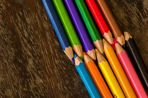 Sort crayons flooring surfaces, bright colors, red, yellow, black, orange and Stock Photos