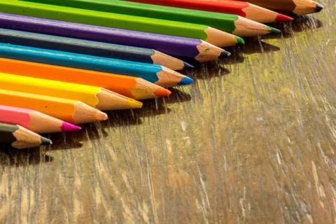 Sort crayons flooring surfaces, bright colors, red, yellow, black, orange and Stock Photos