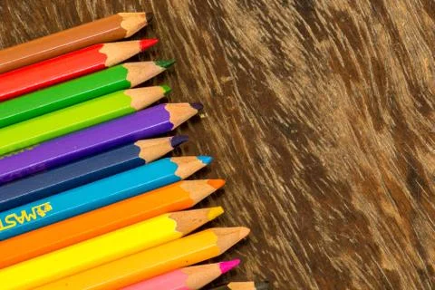Sort crayons flooring surfaces, bright colors, red, yellow, black, orange and Stock Photos