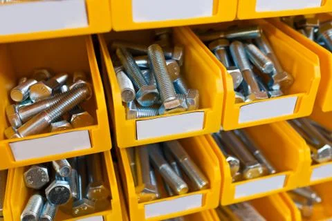 Sorted bolts in boxes in the store Foto stock