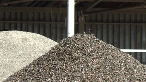 Sorted Gravel Aggregate Stockpiles at Processing Plant Stockbeeldmateriaal 344418168