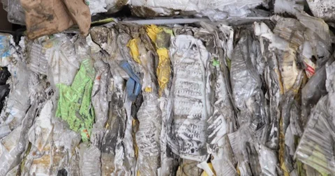 Sorted plastic packages for reuse in warehouse at processing recycling factory. Vídeo Stock 120123347