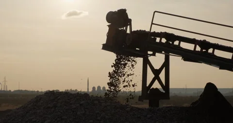 Sorted rocks move on conveyor line, fall into a pile. Crushing screening plant Stock Footage 289199434