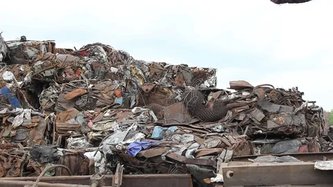 Sorting and loading of scrap metal. Stock Footage 76636363