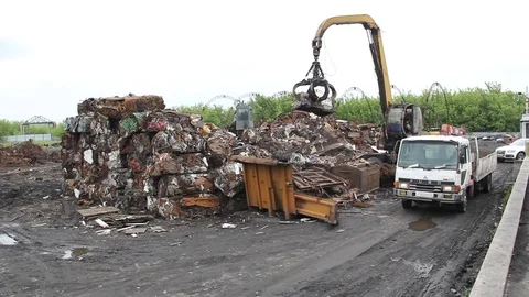 Sorting and loading of scrap metal. Stock Footage 76636491